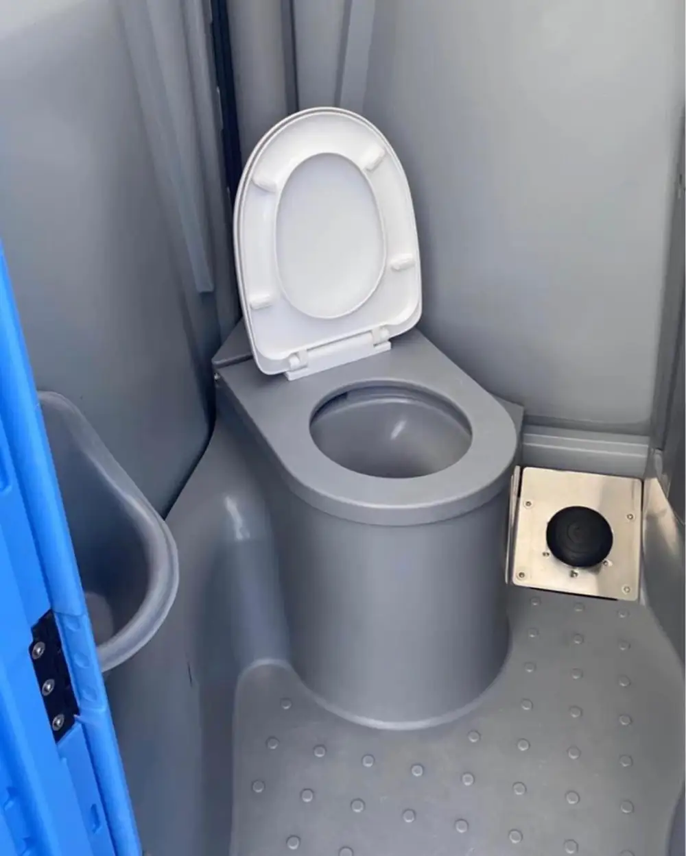 Seat inside a flushing portable toilet